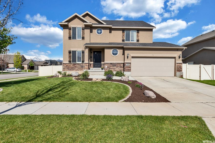 This is Lehi Living at it's best! Built in the Cranberry Farms HOA community, you will have access to a well maintained community pool, huge clubhouse that can be used for family gatherings, park, community garden boxes, soccer field, and quick access to hiking and biking trails on the Jordan River. It's not a misprint, the monthly HOA fee is only $50 per month. This corner-lot Smart-home features 4 bedrooms, 2.5 bathrooms, with a large master bedroom and bathroom. Nest thermostat, smart lock, cameras, Vivint Security system (Must activate), smart plugs and switches. The kitchen's custom Alder ebony glazed cabinets are accompanied by stainless steel appliances and solid surface Corian counter-tops. The dishwasher, microwave and refrigerator are al newer. With recent modern paint and carpet throughout the home, this fully fenced and turn-key two story beauty is very inviting, and ready to be yours! The basement is unfinished, and ready to build out a large bonus room and bathroom, or even add another bedroom, and still accommodate your storage needs. Custom ceiling racks have been installed in the garage as well for additional storage. The property owner is a licensed real estate broker. Square footage figures are provided as a courtesy estimate only and were obtained from County record. Buyer is advised to obtain an independent measurement.
