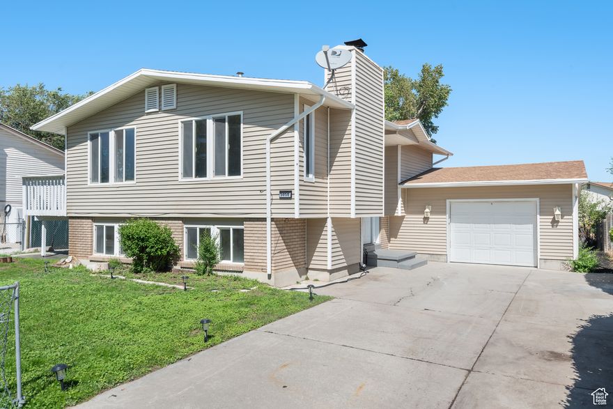 Welcome to this beautifully updated 4-bedroom, 2-bath home featuring a fully finished basement with a separate mother-in-law unit and private entrance. Whether you're looking for additional space for extended family or an excellent opportunity to offset your mortgage with rental income, this home provides the perfect setup. Recent updates include brand-new carpet and flooring throughout, fresh  paint, modern light fixtures, and the convenience of two dishwashers. The home offers an attached two-car deep garage for plenty of parking and storage. Enjoy relaxing or entertaining on the spacious deck that overlooks the yard.  Located in the heart of West Valley, this property places you near shopping, dining, schools, parks, and easy freeway access-making commuting and daily conveniences a breeze. West Valley is a vibrant and growing community, offering a perfect blend of suburban comfort with close proximity to Salt Lake City.