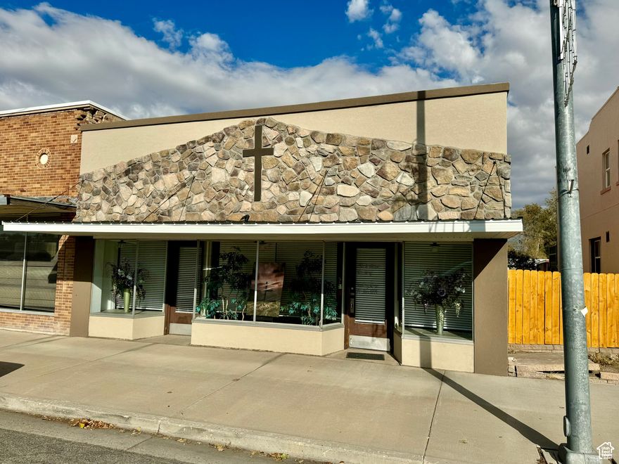 Very nice commercial space on Main Street in Delta. Many potential uses and great visibility! Full glass front allows for natural light coming in south frontage. Interior is partitioned into 3 areas with a total estimated sqft of 3904. Additional back portion of the building is used for storage and estimated to be 640 sqft. 2nd piece of property in the middle of the block is included to allow for lots of off street parking (.25 acre lot). Room to expand. Small kitchenette room plus 2 separate restrooms. Furnace room in basement.