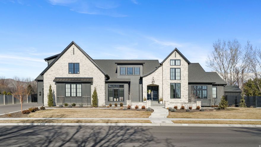 This exceptional property offers space, functionality, and luxury in one of the most convenient locations around. The main residence features 6 bedrooms with generous living areas designed for both everyday comfort and entertaining.  Above the detached garage, you'll find a fully equipped additional living space with 2 bedrooms, a kitchen, and private living area - ideal for guests, extended family, or multi-generational living.  The heated detached garage is a standout feature, accommodating up to 4 vehicles with ample room remaining for a workshop, home gym, or hobby space. Outdoor living is equally impressive with a pool, hot tub, and private pickleball court, plus a dedicated pool bathroom for easy access without entering the main home.  Inside, the kitchen is outfitted with Wolf appliances, a Sub-Zero refrigerator, and a spacious butler's pantry, offering both high-end performance and exceptional storage. A large theater room with surround sound creates the perfect in-home entertainment experience.  Conveniently located near Costco, Walmart, Target, and Harmons, with easy freeway access and approximately 30 minutes to both Provo and Salt Lake City airports, this home combines luxury living with everyday practicality.  Buyers to verify all information and accuracy of acreage and square footage. This is provided as a courtesy only.