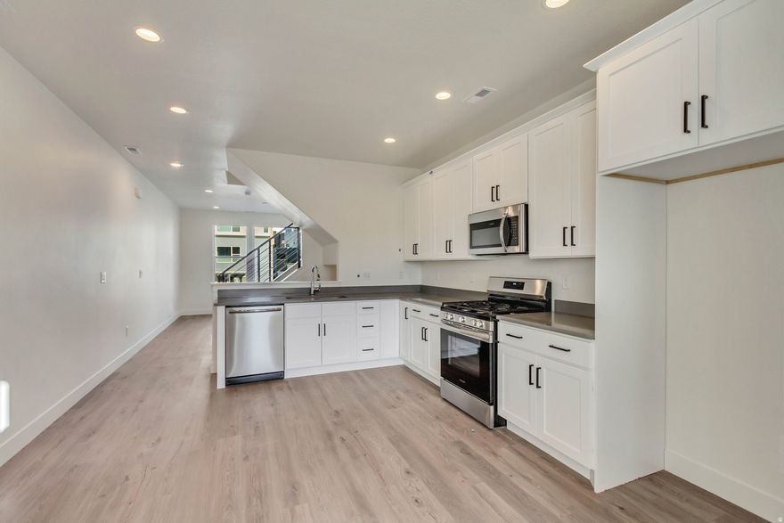 ** Newly Released Manhattan Floor Plan in the New Downtown Daybreak Area and just a Short Walk to the Bee's Ballpark! This 2 Bed 1.5 Bath + Flex Room has 9 ft. Ceilings on all Floors, Gas Appliances, Upgraded Cabinets, Flooring and Open Railing for an Elevated and Luxury Feel. Estimated Completion June/July, 2026. Home is at HVAC/ELEC** Interior Photos are Example of and Not of Actual Home.