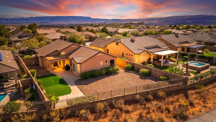 Coral Canyon with Unobstructed Views Experience elevated desert living in this beautifully maintained four bedroom, two bathroom home located in the highly sought after Highland neighborhood of Coral Canyon. Perfectly positioned on a premium lot with no rear neighbors, this property offers sweeping, unobstructed views and exceptional privacy. Designed with an open and inviting floor plan, the home is bright, spacious, and truly move in ready. It is being offered fully furnished, making it an ideal primary residence, second home, or turnkey retreat. Just bring your suitcase and start enjoying the St. George lifestyle.  The expansive backyard provides endless potential with ample space to add a pool or create a custom outdoor living area. A private putting green adds a unique, resort style touch and has quickly become a favorite feature among buyers.  Inside, the well appointed kitchen opens seamlessly to generous living and dining spaces, while the primary suite captures stunning views and offers a peaceful place to unwind.  Residents of Coral Canyon enjoy access to exceptional amenities including pools, golf, trails, and parks, all conveniently located near shopping, dining, and I 15.  Recent upgrades include a fully updated AC system, plumbing stub outs for a future pool, and a 50 amp outlet in the garage ready for electric vehicle charging.  Opportunities like this are rare. Privacy, views, and a turnkey offering come together in one of St. George's most desirable communities.