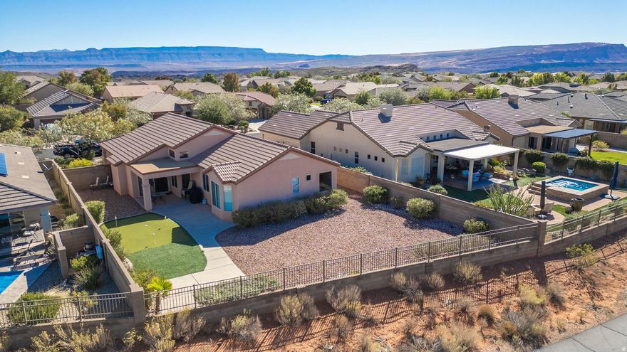 Coral Canyon with Unobstructed Views Experience elevated desert living in this beautifully maintained four bedroom, two bathroom home located in the highly sought after Highland neighborhood of Coral Canyon. Perfectly positioned on a premium lot with no rear neighbors, this property offers sweeping, unobstructed views and exceptional privacy. Designed with an open and inviting floor plan, the home is bright, spacious, and truly move in ready. It is being offered fully furnished, making it an ideal primary residence, second home, or turnkey retreat. Just bring your suitcase and start enjoying the St. George lifestyle.  The expansive backyard provides endless potential with ample space to add a pool or create a custom outdoor living area. A private putting green adds a unique, resort style touch and has quickly become a favorite feature among buyers.  Inside, the well appointed kitchen opens seamlessly to generous living and dining spaces, while the primary suite captures stunning views and offers a peaceful place to unwind.  Residents of Coral Canyon enjoy access to exceptional amenities including pools, golf, trails, and parks, all conveniently located near shopping, dining, and I 15.  Recent upgrades include a fully updated AC system, plumbing stub outs for a future pool, and a 50 amp outlet in the garage ready for electric vehicle charging.  Opportunities like this are rare. Privacy, views, and a turnkey offering come together in one of St. George's most desirable communities.