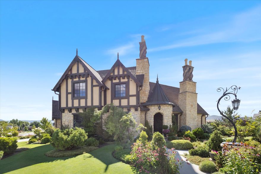 Nestled in the coveted Cascades at Soldier Hollow in Midway, Utah, this extraordinary residence showcases timeless Normandy-inspired architecture paired with exceptional craftsmanship throughout. A striking copper turret roof, along with matching gutters and downspouts, sets the tone for the home's distinctive character, complemented by full bed stone construction and beautifully twisted brick chimneys. Inside, every detail has been thoughtfully curated, from the hand-carved Venetian plaster entry to the four stunning masonry fireplaces that add warmth and elegance throughout. The gourmet kitchen is a chef's dream, featuring premium Thermador appliances, twin dishwashers, and exquisite Rohl fixtures. In this cozy cottage authenticity and artistry shine with handmade clay tile imported from England and a classic clawfoot tub that enhances the home's refined charm. Every element of this residence has been custom designed, creating a one-of-a-kind living experience that blends luxury, comfort, and architectural beauty. This is truly luxury living at its finest in one of Midway's most sought-after communities.