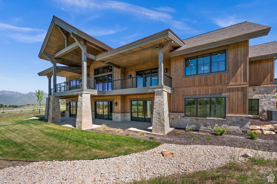 This exquisitely crafted residence masterfully blends contemporary luxury with timeless elegance, offering a serene retreat for the discerning homeowner. Nestled on a beautifully landscaped half acre in the coveted Red Ledges community, this property balances convenience with tranquility. Soak in breathtaking views of Mount Timpanogos from your private patio, perfect for serene morning moments or hosting unforgettable evenings under the stars. From the moment you enter the home, you'll notice a seamless blend of comfort and sophistication across the main level's seating and dining areas, complete with two fireplaces on either end of the main floor and comfortable social, culinary, and workspaces throughout. At the heart of the home is a chef's dream kitchen, complete with state-of-the-art appliances, a Miele coffee station, granite countertops, an oversized pantry, and ample storage space. Serving as a primary bedroom sanctuary, retreat to the elegant main-level bedroom complete with a spa-like ensuite bath and a spacious walk-in closet. The light-filled lower level features a large family room with a fireplace and wet bar with ample space for fun and games. Walk straight outside the lower level to a covered patio also boasting mountain views.   Any lifestyle you desire in the West has a level of convenience that comes with Ownership in The Red Ledges. The luxurious clubhouse features a restaurant & bar facing Utah-unique red rock cliffs, accentuating the juxtaposition to world class skiing found just minutes away. The clubhouse also boasts a fitness club, serene pool, sports shop, and so much fun for kids and adults alike. Tennis, pickleball, lawn games, a pool-side grill, playground, and waterslide will enable memories for years. Red Ledges is also a home for golf excellence. Home to an award-winning 'Jack Nicklaus Signature Golf Course', complemented by the 'Jim McLean Golf School' and top-tier practice facilities. Red Ledges is also 10 minutes to multiple other sensational golf courses. Red Ledges offers exclusive Deer Valley access with three on-mountain, ski-in/ski-out private lodges and complimentary luxury ski shuttles providing hassle-free transportation. This highly sought after community is moments from world class skiing, fly-fishing, ATV/UTV/Jeep and Off Roading Trails, Mountain Biking, Hiking, Boating, and other water sports at both Deer Creek and Jordanelle Reservoir. Don't miss this opportunity to flourish in the mountains about an hour's drive from an international airport. Schedule your private showing today and experience a home where luxury meets tranquility-crafted for comfort, style, and unforgettable moments.