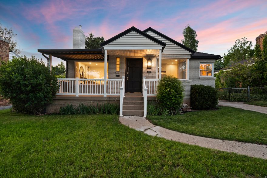 Welcome home to this thoughtfully updated four-bedroom, two-bathroom property nestled on the picturesque, tree-lined Wilson Avenue in the heart of Salt Lake City. Designed by Seventh & Stone, the home features rich engineered hardwood floors, custom moldings, high-end finishes, and an open-concept layout designed for today's lifestyle. The main bathroom showcases marble flooring and a custom walnut double vanity, while the lower level offers cozy wool carpet and a sophisticated second bath with a walk-in shower and glass enclosure. Outside, enjoy a covered front porch, spacious backyard, covered patio, garden boxes, and an extra-large one-car garage with ample storage. Perfectly positioned near the Foothill Village redevelopment and the 21&21 project, this home offers a rare opportunity to enjoy both neighborhood charm and the future of Salt Lake City living. Square footage figures are provided as a courtesy estimate. Buyer is advised to obtain an independent measurement.