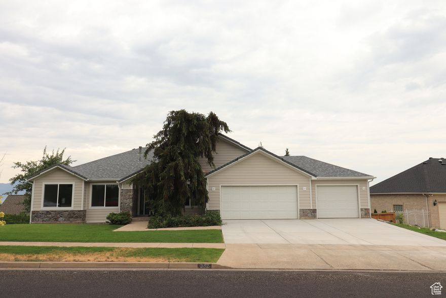 Wonderfull Cliffside home on a large corner lot with exceptional views. Newly remodeled with New flooring, New extra large composite deck, Brand New roof, New siding, New Granite countertops. Three bedrooms two bathrooms two fire places two living rooms. Large walk out basement with potential for additional bedrooms and bathrooms and a large three car garage. Great location on the east bench of Logan. Like a new home in a nice quit neighborhood, Easy to see, motivated seller, move in ready call for a showing.