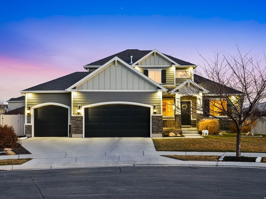 ***OPEN HOUSE SATURDAY 2/7/2026 11:00AM TO 1:00PM*** Nestled on a quiet cul-de-sac in Eagle Mountain, this stunning 6-bedroom, 4-bath home sits on a generous -acre lot and immediately impresses with its exceptional curb appeal. Step inside to a welcoming entryway and formal living area that set a refined tone, enhanced by thoughtful details such as board-and-batten accents, modern lighting, and neutral finishes throughout. As you move further into the home, the open great room unfolds with large windows that frame scenic views and fill the space with natural light. The spacious family room flows seamlessly into the dining and kitchen areas, creating an ideal layout for both everyday living and entertaining. Continue into the beautifully designed kitchen featuring crisp white cabinetry, granite countertops, a gas range, stainless steel appliances, a large pantry, and a generous island with bar seating. The adjacent dining area offers easy access to the covered deck-perfect for indoor-outdoor living and enjoying Eagle Mountain's breathtaking sunsets. The main-level primary suite includes a well-appointed en-suite bathroom with a spacious vanity, standing shower, and access to a large walk-in closet. A convenient half bath and laundry area with built-in storage complete this level. Upstairs, a bright sitting room showcases sweeping views of the mountains, city, and lake. Three additional bedrooms-including one with its own en-suite-plus a full bathroom and a dedicated laundry room with built-in cabinetry (currently used as an office) round out the second floor. The expansive daylight basement offers incredible versatility with a second family room, full kitchen with granite countertops, dedicated laundry room, two bedrooms (one with a walk-in closet), a full bathroom, and abundant storage. Featuring private walk-out access, this space offers excellent flexibility for guests, multigenerational living, or income potential. Outside, the fully fenced backyard features a covered deck with recessed lighting, a partially covered patio below, breathtaking mountain views, and a thriving garden with apples, peaches, blackberries, and raspberries. Additional highlights include a 3-car extended garage, cold storage, and a second-level furnace. Ideally situated within walking distance of highly rated schools, parks, and nearby trails, this home truly offers the best of Eagle Mountain living. Don't miss your chance to make it yours! The seller is willing to entertain any and all requests in an offer AGENTS - READ AGENT REMARKS