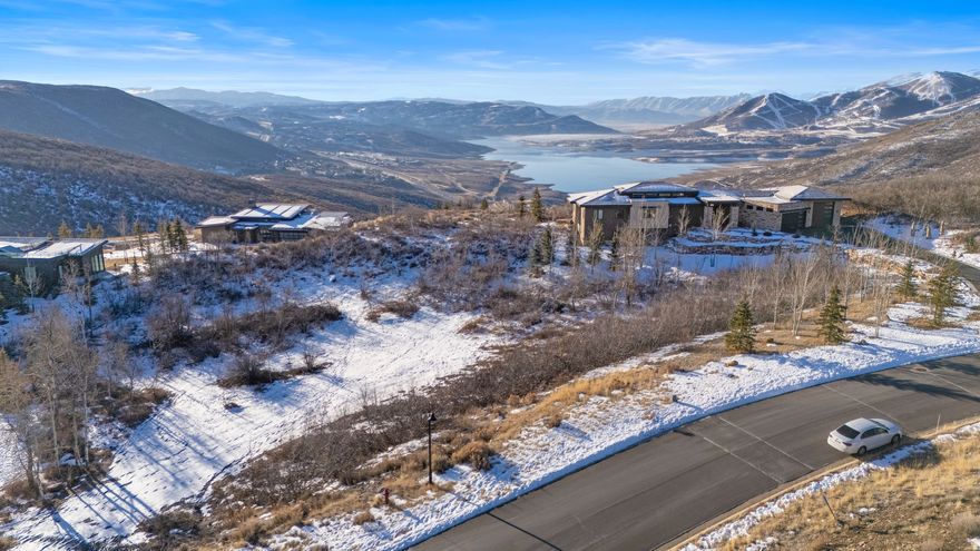 Lot #48 sits in the upper tier of Deer Vista, offering a gently sloped .85-acre homesite that's tailor-made for a custom mountain home. Directly adjacent to the community park, this setting delivers breathing room, quiet, and uninterrupted views of the Wasatch Range-no back-deck surprises here.  Deer Vista is a thoughtfully planned community of just 103 estate homesites spread across more than 400 acres overlooking the Jordanelle recreation area. The Deer Vista community views stretch wide-from Deer Valley's ski terrain to the Canyons side of Park City Mountain-giving this neighborhood its name and its edge.  Location, location, location. You're about 10 minutes to Park City's Main Street, roughly 10 minutes to the lifts at Deer Valley Resort, five minutes to the Jordanelle Reservoir, and under 40 minutes to Salt Lake International Airport. Close enough to everything, far enough to feel like you actually escaped.  Four seasons of recreation come standard here. Ski days, trail runs, paddleboards, bikes, boats-it's all within minutes.
