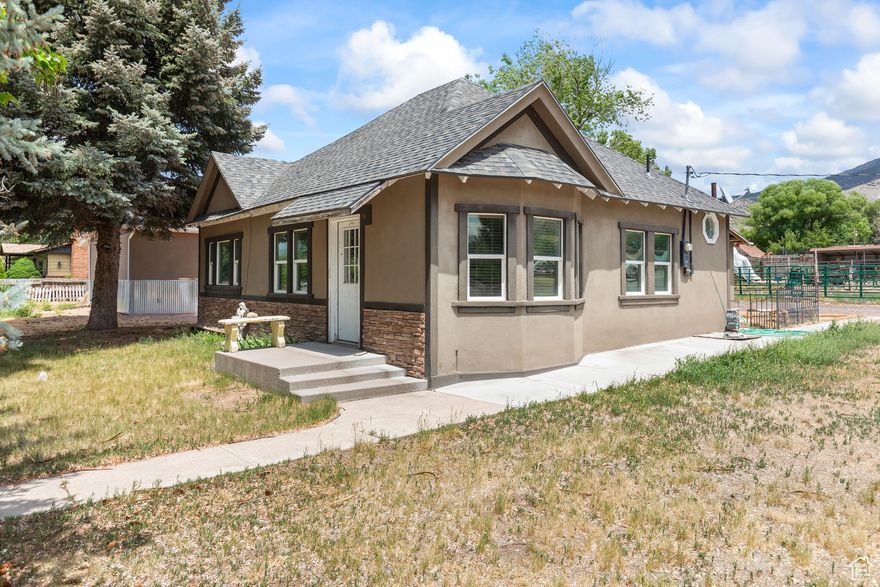 Discover small-town charm and big possibilities with this adorable 2-bedroom, 1-bath cottage nestled in the heart of Monroe-a town that feels like living in a Hallmark movie. This unique property offers more than just a cozy home; it includes a professionally built recording studio that's climate-controlled, energy-efficient, and filled with natural light from its stunning skylights and polished concrete floors. The studio space could easily be converted into a guesthouse, office, or small second home.  Bring your animals-this property includes a 4-stall barn and sits in a livestock and horse-friendly neighborhood. Outdoor enthusiasts will love the direct access to ATV trails and the town's ATV-friendly streets. Enjoy evenings fishing at the local pond or watching paragliders float to the ground just beyond your yard.  Whether you're a creative spirit, an animal lover, or just someone looking for a peaceful place to call home, this Monroe gem offers a lifestyle as picturesque and welcoming as the town itself.