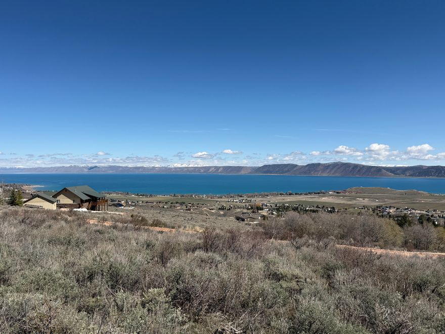 Are you looking for a quiet, family-friendly Bear Lake escape? Sweetwater Hill is just the place. This beautiful 1-acre lot offers incredible views of Bear Lake and is ideally located at the end of a cul-de-sac, providing added privacy and seclusion. Enjoy easy access to nearby trail systems leading into the National Forest-perfect for year-round outdoor recreation. Just minutes from Garden City, local restaurants, the Utah State Marina, and public beaches, you'll have everything you need close at hand while still enjoying a peaceful mountain setting. No short-term rentals are allowed, helping preserve the quiet, neighborhood feel. Access to ideal beach amenities is available for purchase with an annual fee, adding even more value to this exceptional property.