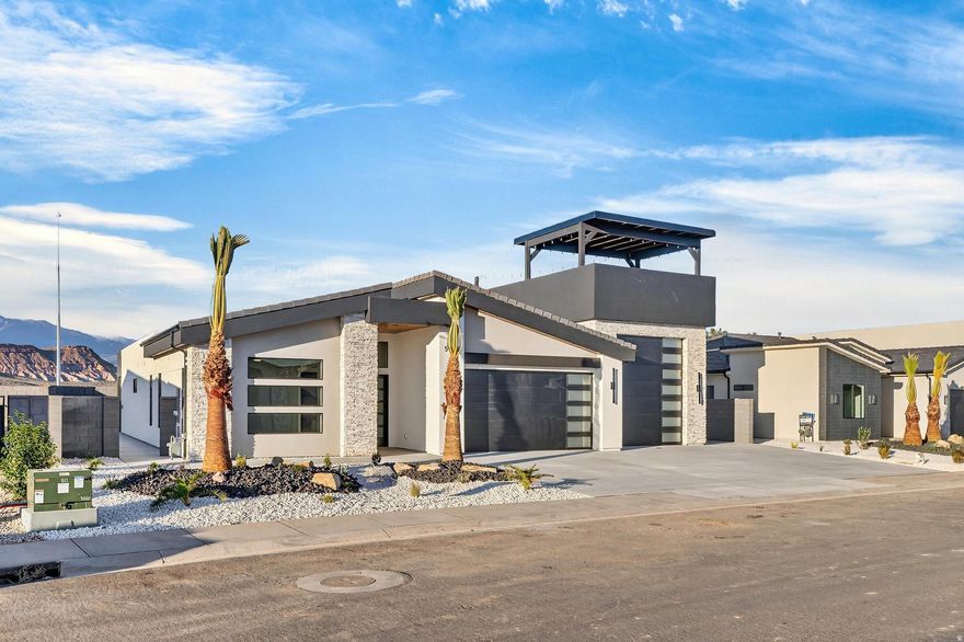 Experience modern desert living in this stunning contemporary home. Designed with open spaces and natural light, the great room seamlessly connects the kitchen, dining, and living areas, showcasing views from every angle. This 4-bed, 3-bath layout includes a private casita with its own kitchenette and bath, perfect for guests or Airbnb rental income. Enjoy a spacious primary suite with a walk-in closet, a large covered patio for outdoor living, and a 4-car oversized garage with an RV bay. Featuring sleek low-pitch roofs, stucco with wood and stone accents, and clean modern lines, this home blends luxury, function, and style in the heart of Southern Utah. Not all photos are of this home.