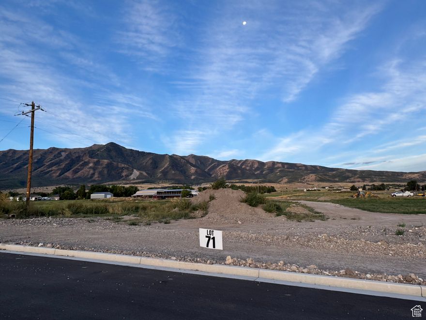 Bring your own Builder! Multiple lots available - Build your dream home in the peaceful and scenic community of Mendon. Blueberry Springs offers spacious 5/8+acre lots with breathtaking views of the mountains and valley. Enjoy paved public roads and full utility access, including Mendon City water, data, power, and secondary water stubbed to each lot. Irrigation water is managed and maintained by the Blueberry Springs HOA. Buyers are responsible for choosing and installing a septic system, subject to approval by Cache County. Each lot includes curb, gutter, and sidewalk frontage. This subdivision allows animal rights in accordance with Mendon City ordinances (https://mendoncityutah.gov). Bring your own builder and design your ideal home while adhering to city setbacks and protective covenants that maintain the neighborhood's appeal.