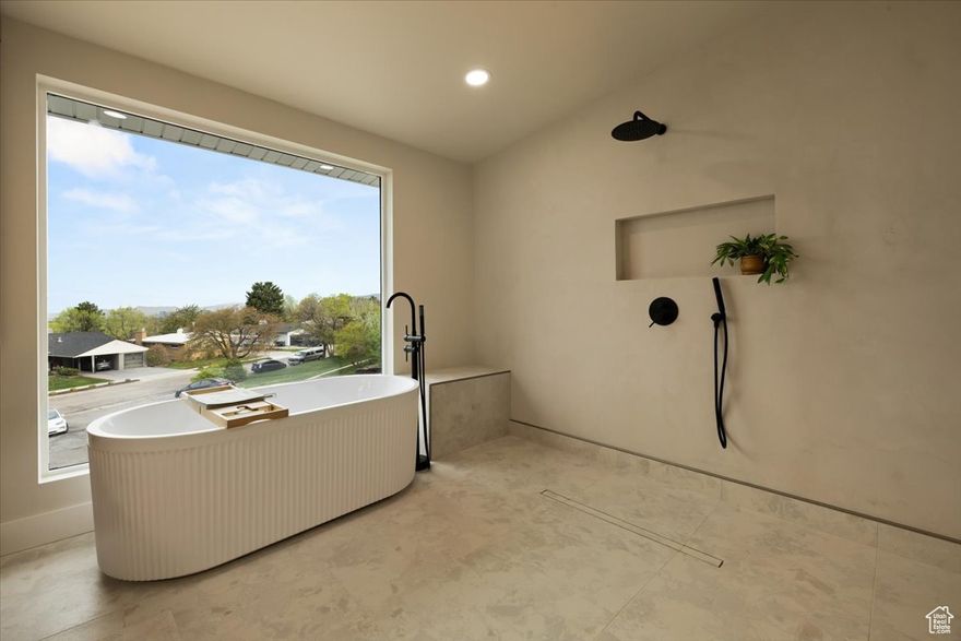 Established East Bench neighborhood meets updated home with luxury finishes! This 4 bed, 3 bath home has everything from custom cabinets, quartz countertops, spacious primary suite plus views of downtown SLC! Features also include heated floors in primary bathroom, indoor/outdoor enjoyment, spacious 2 car garage with ample storage throughout and more! Close proximity to the University of Utah, downtown Salt Lake, I-215 and I-80 as well as fabulous shopping and dining!