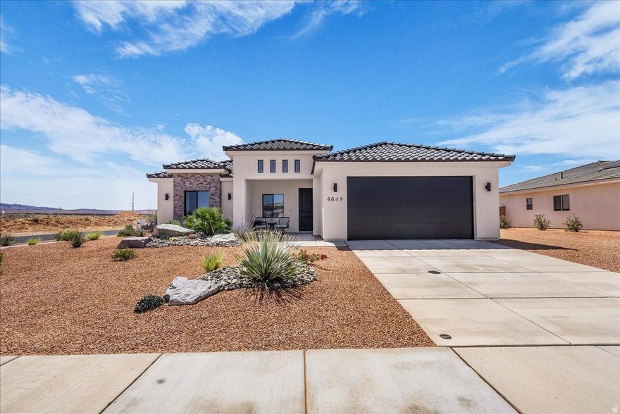 This stunning home is nestled in one of the most scenic locations in Southern Utah. Views galore surround this meticulously maintained home which is situated on a large corner lot with ample space to add RV parking. The home has a functional open concept floor plan, and includes many premium finishes: 10' vaulted ceilings, master suite with walk-in closet, kitchen island, quartz countertops, waterproof flooring that adds beauty and durability, stainless steel appliances, walk-in pantry, reverse osmosis, water softener system and more. The private, beautifully landscaped and low maintenance backyard, offers amble space for entertaining and relaxing. This very desirable location, is just minutes from exploring Sand Hollow State Park, sand dunes, and hiking/biking/ATV trail. This is an exceptional value for this amazing home!