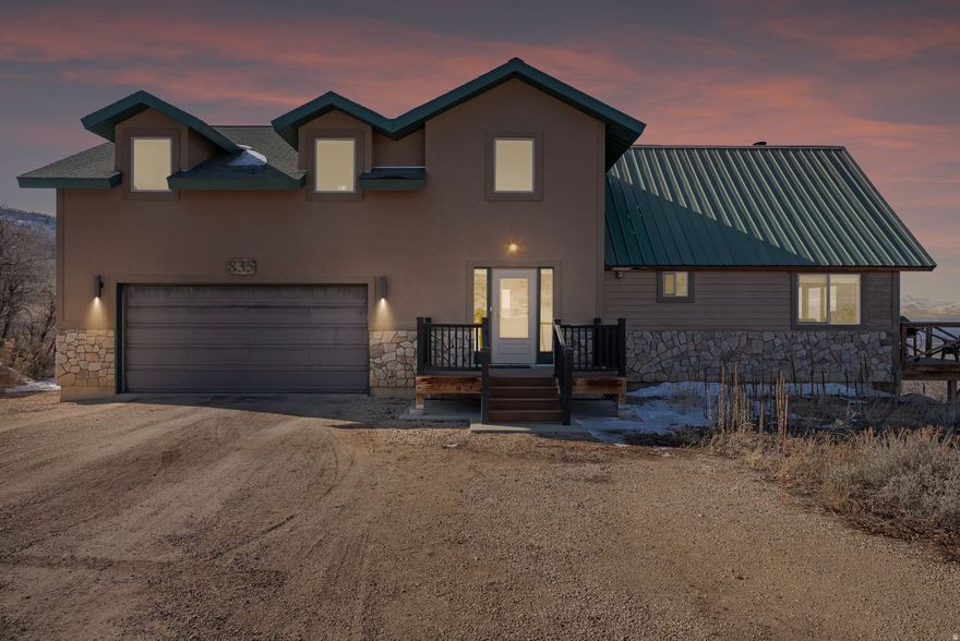 Refined mountain living awaits in this beautifully appointed 3-bedroom, 3-bath residence located within the sought-after Timber Lakes community. Owners enjoy access to approximately 23 thoughtfully preserved common areas, offering a private network of maintained open space, scenic lakes, picnic areas, recreation zones, and clearly marked trails. The community features an active trail system including the Westview Trail (~1.5 miles), Moose Trail (~2.5 miles with additional loops), and tranquil lake-area paths surrounding Jones Lake, Clyde Lake, Bench Lake, and more.  The home welcomes you with a tiled entryway and an inviting main living space filled with natural light. Architectural wood ceilings, a Heritage wood-burning stove, and expansive views create a warm yet upscale mountain ambiance. Sliding doors open to a spacious Trex deck, ideal for outdoor entertaining. The kitchen is equipped with Frigidaire and GE appliances and flows seamlessly into the main living area.  A generous main-level bath features a glass-surround shower, antique vanity, wood flooring, and linen storage. The upper level offers a serene bedroom retreat with dual closets, a dedicated office, and an additional bedroom with extra storage and a charming Romeo & Juliet balcony. The upper bath includes a double vanity and a tile walk-in shower with bench.  The lower level offers exceptional flexibility and can function as a private en-suite, game room, or secondary living area, featuring walk-out access, a well-appointed bathroom with tile flooring and tile shower, a laundry room with sink, and a game closet-ideal for guests or recreation.  Exterior highlights include Trex decking, stone accents, a heated 2-car garage, separate storage shed, and ample parking. Conveniently located with easy access from the security gate.