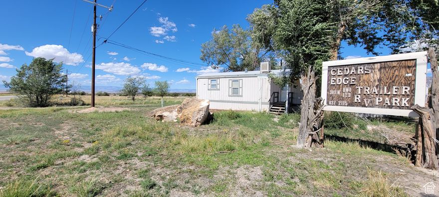 Opportunity plus on this 12.54 acre property. This property currently has 12 RV/Mobile Home spots with hook ups, on approx. 1 acre, and includes an owner, manager, or rental mobile home. The other mobile homes are owned by the tenants. That leaves a large chunk of land to expand, build a storage unit, a custom home, or something else. Beautiful views, and this property is on the way to Green River, and Moab. Tenants pay electric and gas. Square footage figures are provided as a courtesy estimate only. Buyer is advised to obtain an independent measurement. Also cross listed as land  #2110686.