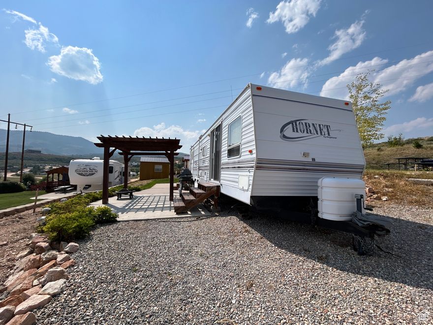 Turn-Key RV lot in Bear Lake RV Park, complete with a trailer and a ton of fantastic improvements. This. lot boasts a concrete pad with a stylish pergola, which features a cover with walls that can be brought down for added comfort. The property is equipped with an automatic sprinkler system. A spacious shed with a concrete pad provides ample room for storing a side-by-side vehicle, while an additional tool shed offers extra storage for all your needs. Stay connected with DOT Bar WiFi and enjoy entertainment with the included Dish satellite. Outdoor adventure is at your doorstep with hundreds of miles of mountain trails access-perfect for ATVs, motorcycles, bikes, and snowmobiles. This RV lot offers a perfect blend of comfort, convenience, and outdoor enjoyment in the stunning Bear Lake area. Don't miss this unique opportunity to own a beautifully improved property that's ready for you to move in and enjoy!