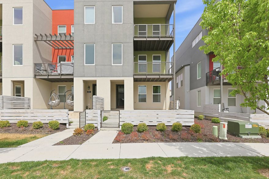 Welcome to this beautifully maintained end-unit townhouse, perfectly situated in a highly sought-after community just minutes from downtown Daybreak, the Ballpark, and major highways. Thoughtfully designed with an open-concept layout, the home is filled with natural light from large windows that create a bright and welcoming atmosphere.  The stylish, high-end kitchen is truly the heart of the home-featuring quartz countertops, a gas range, and convenient counter seating, making it perfect for both everyday living and entertaining.  Enjoy the added convenience of extra parking behind the home, along with all the benefits this vibrant community has to offer. This move-in-ready gem is ready for you to settle in and make it your own.