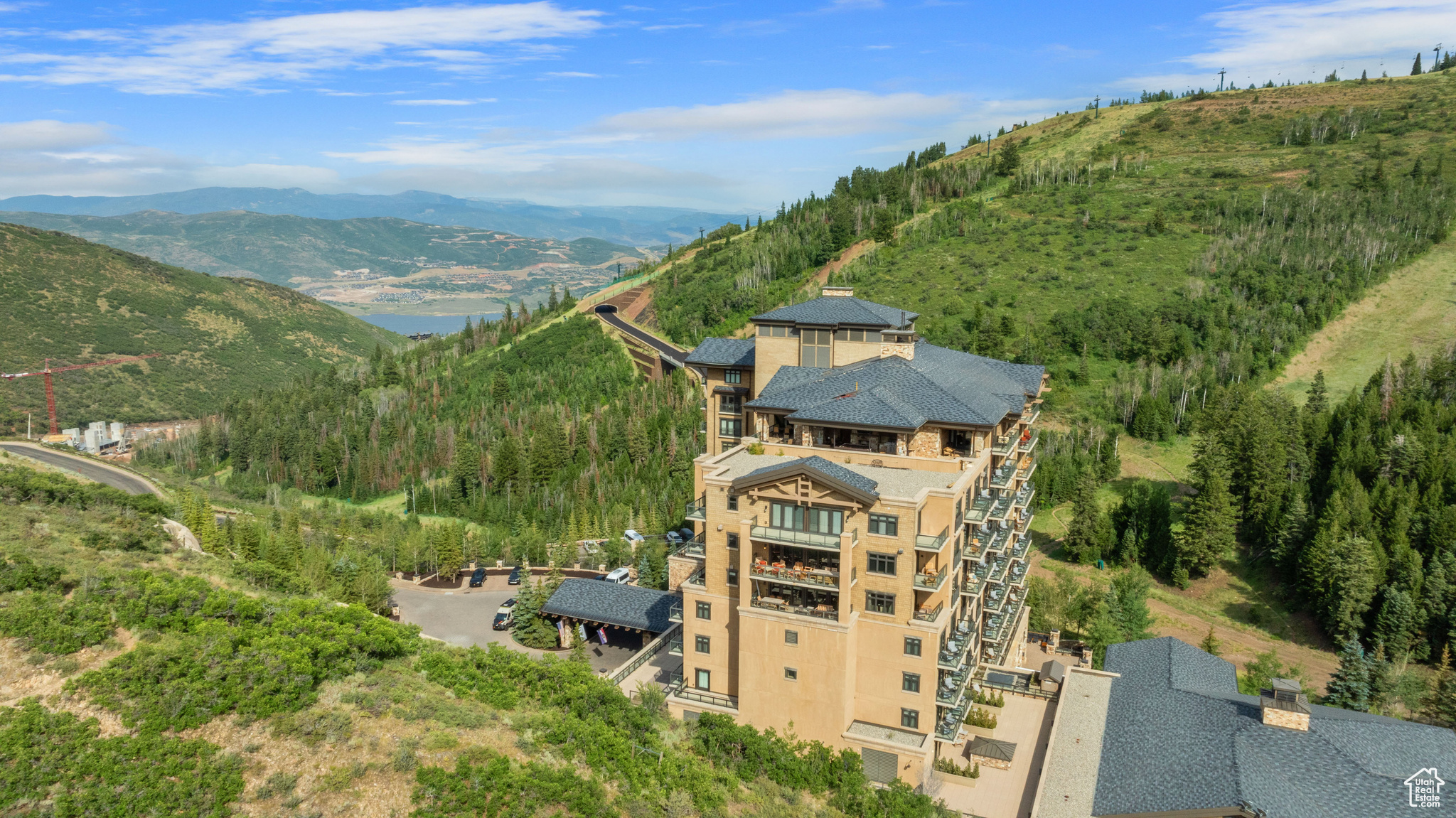 Luxurious, top floor penthouse suite in the exclusive St. Regis Deer Valley. Enjoy immediate access to the Deer Valley Resort and breathtaking, panoramic views of Park City, the Wasatch Mountains, and Jordanelle Reservoir. Modeled after the grand castles of Europe, this condo was built with striking attention to detail. 5 spacious bedrooms with en-suite bathrooms, a gourmet chef's kitchen and butler's pantry with high-end Wolf appliances, custom wood beams, flooring, cabinetry, and trim, 5 stone fireplaces, a private elevator, wine cellar, and over 2,000 square feet of outdoor living space complete with enclosed hot tub, grill, heaters, bar, and fireplace. The St. Regis Deer Valley provides unparalleled luxury and comfort including the St. Regis ski beach with ski-in ski-out valet service, where they help you remove your boots and store your ski equipment. Ownership also comes with access to ski lockers, a ski rental shop, boot warmers, aprs ski DJ and cocktails, slope-side heated swimming pool and hot tubs, the St. Regis spa, on-demand butler service, several fine dining options including Italian, French, Seafood fare and hand-crafted cocktails, the St. Regis Wine Vault, daily guided mountain hikes, pool-side movie nights, golf simulator suite, athletic club, valet parking, paid electrical, gas, water, sewer, and trash, just to name a few. Park City's finest offerings are at your fingertips with world-class skiing, hiking, and biking trails, music and art festivals, high-end shopping, fine dining al fresco, and craft beers on Park City's Historic Main Street. Just 40 minutes to the Salt Lake City International Airport. Comes with option to join the limited-membership ski and social Deer Crest Club. Don't miss out on this rare opportunity to own just one of two penthouse suites at the St. Regis Deer Valley.