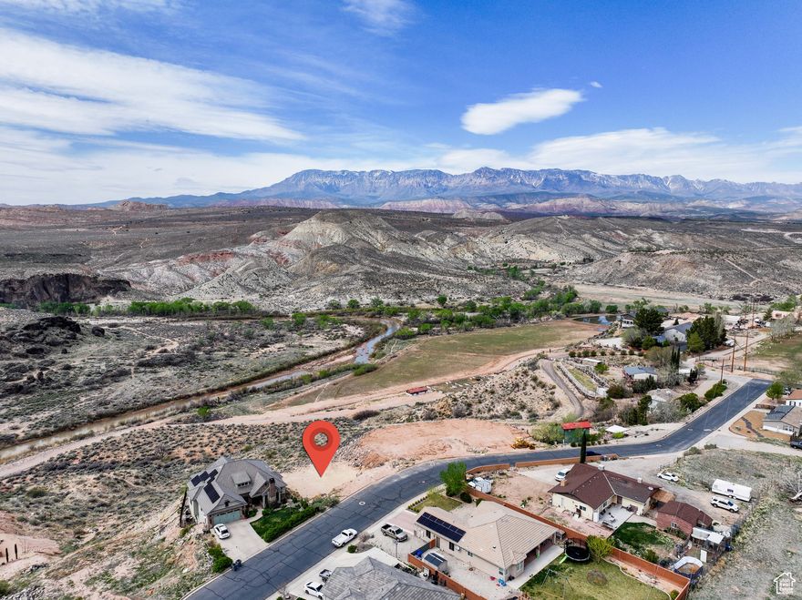 Experience breathtaking views at the gateway to Zion National Park, complete with some of the best hiking, biking, and country landscapes in the West! This flat homesite (bring your builder!), located high above Ash Creek in a quiet neighborhood with no through traffic, is perfect for your dream home. You'll be less than 5 minutes from River Rock Roasting Co., Stage Coach Grille, Red Fort, and the newly renovated Zion Canyon Hot Springs. Plus, you're only 22 miles from Zion Canyon itself!