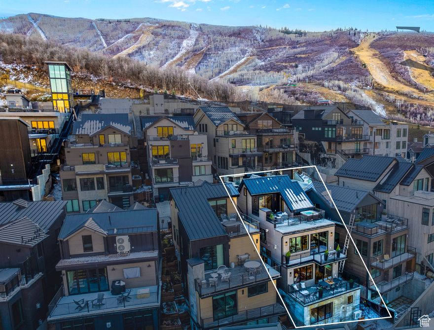 Don't miss your chance to discover unparalleled luxury in this stunning mountain modern home, ideally on the prestigious Kings Crown run in Park City, Utah. This property is ideal both as a primary residence or an investment opportunity, making it a perfect retreat for embracing the ultimate Park City lifestyle. Spanning over 2,500 sq. ft., this ski-in, ski-out masterpiece offers a seamless blend of contemporary design and cozy mountain charm. The open-concept living area features expansive windows that bathe the space in natural light while framing breathtaking mountain views. High-end finishes abound, including rich hardwood floors, a state-of-the-art chef's kitchen with top-of-the-line appliances, and exquisite details throughout. Each of the three bedrooms is a sanctuary of comfort, with luxurious bathrooms and 2 primary suites featuring their own private en-suite and spa-like baths. The bonus bedroom can be used for anything you desire; it is currently being used as a bunk room. A fully permitted and successful Nightly rental, this home is expected to generate over $ 300,000 this year. The home comes fully furnished with meticulously chosen pieces that complement its elegant aesthetic. Enhancing your experience, the private ski tower provides direct slope access, while the owner's lounge and ski lockers offer added convenience and luxury.  An elevator to the run and thoughtful details throughout ensure effortless living. Conveniently located a 2-minute drive or a 5-minute walk from Main Street, you're close to all the shopping, dining, and amenities Park City offers.  Square footage figures are provided as a courtesy estimate only and were obtained from appraisal.  Buyer is advised to obtain an independent measurement.