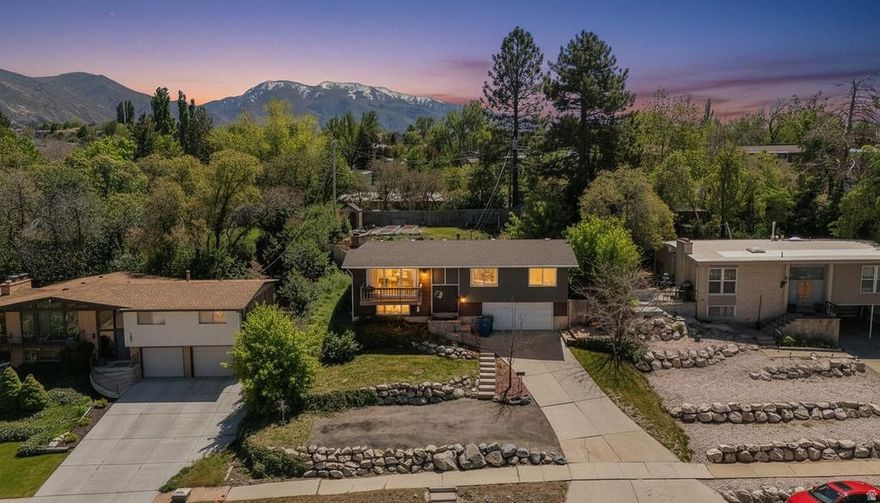 Best views in the neighborhood! This beautifully landscaped home features an open-concept floor plan with expansive windows & a spacious deck showcasing breathtaking views. The main floor offers 3 bedrooms, including a primary en-suite. step into the basement that leads to an oversized garage with a workshop area. Enjoy your own backyard oasis with a private deck, garden boxes, & lush landscaping. All conveniently located near schools, parks, & a fishing pond.