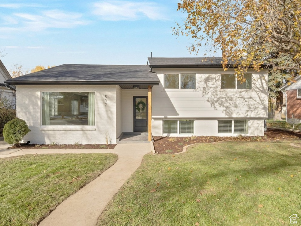 Discover the epitome of modern luxury, just moments from the lively Millcreek Commons & Brickyard! This beautifully remodeled home welcomes you with a stunning black slate entryway that sets the tone for what's inside. Step into a bright, open floor plan where style and function seamlessly unite. The chef-inspired kitchen is a standout, featuring custom cabinetry, striking quartz countertops, subway tile backsplash and walk in pantry. Elegant gold hardware and fixtures add a sophisticated touch throughout.  Upstairs, the spa-like primary bathroom exudes tranquility, with floor-to-ceiling tile and a contemporary wall-mounted sink. The main bathroom is equally impressive, showcasing a double vanity and a serene, refined atmosphere. Every inch of this home has been thoughtfully upgraded, including brand-new flooring, fresh paint, a new roof, cutting-edge HVAC, plumbing, and electrical systems.  Outside, enjoy a newly built deck and an oversized two-car garage complete with a workbench, underground cold storage, and a new garage door. A convenient sprinkler system ensures easy outdoor upkeep.  This home's prime location places you within walking distance of boutique shops, gourmet restaurants, food trucks, art galleries, a skating rink, and lively community events at Millcreek Commons. Plus, with quick access to Downtown Salt Lake City and world-class ski resorts, it's the perfect blend of luxury, convenience, and style. Don't miss the chance to call this stunning property your own!