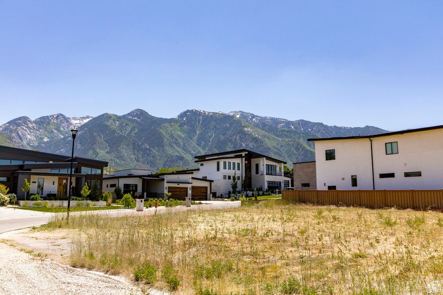 This 0.36 acre corner lot provides a flat, buildready site perfect for a $2 to $5 million modern masterpiece near the base of Little Cottonwood Canyon, with mountain vistas to enjoy each morning and evening. All utilities -  gas, power, and sewer are stubbed, simplifying the permitting process so you can focus on selecting finishes and contemporary architectural details. Nestled on a street defined by sleek, modern homes, this lot benefits from an overall design aesthetic that emphasizes clean lines, large windows, and upscale materials, setting the tone for a cohesive and cuttingedge community feel. A reputable local builder is standing by to collaborate on your vision, ensuring a seamless transition from architectural concept to final walkthrough. For more information or to schedule a builder consultation, please contact agent.