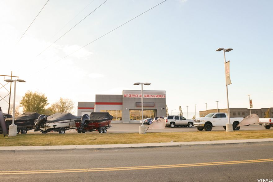 AMAZING LOCATION. Faces I-i5. Springville Frontage Rd. Beautiful building for auto/marine/heavy equip/vehicle dealership or retail sales company. Well lit, all glass showroom facing the freeway, 250 display/service stalls. 5 Offices, break room and conference room upstairs with beautiful views. Bathrooms up and down. Parts room, Service bay, 4 offices on main. 8 garage doors, 9 bays, 4--12' doors, 4--14' doors. permanent fixture signage visible from I-15. Billboard negotiable directly above. Fenced in/secure storage. full landscape. If you want I-15 exposure, this is it. nothing else avail in this area. When new off-ramp goes in south Springville, you'll be glad you bought when you did! over 500K cars a day pass by...15M/mo...186M/yr...tons of exposure! Business is negotiable. Business is NOT included in this price.  please call for details.