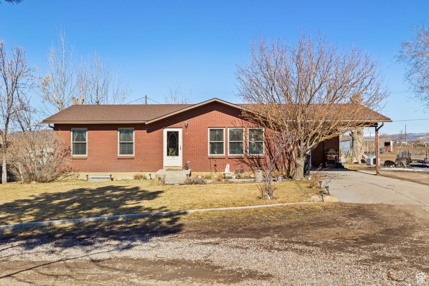 Charming Brick Rambler on 1 Acre-Horse Property Within City Limits!! Enjoy the best of both worlds with this beautifully maintained brick-style rambler, offering 5 bedrooms, 2 bathrooms, and plenty of space for comfortable living-inside and out. Nestled on 1 acre within city limits, this unique horse property is fully fenced and thoughtfully equipped for animals large and small. The grounds feature a spacious garden area, a hay barn, horse corral with included panels and gates, a chicken coop, and pressurized irrigation. Whether you're looking to homestead or simply enjoy wide-open space with modern conveniences nearby, this property is a rare find. Experience peaceful country living right in town! Property lines are shown as approximate.  All information within is provided as a courtesy only.  Buyer and Buyer's agent to complete their own due diligence. Square footage figures are provided as a courtesy estimate only and were obtained from tax records.  Buyer is advised to obtain an independent measurement.