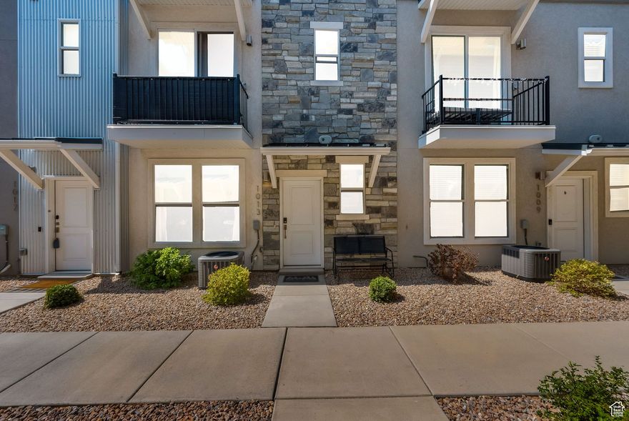 Welcome to The Soho model in The Ridge at Spanish Fork. This spacious townhome offers 3 bedrooms, including the largest primary suite in the development, along with 2.5 bathrooms and a flexible layout ideal for modern living. The lower level features a cozy family room and an extra-deep two-car garage with a LiftMaster HD WiFi-enabled opener and a 240V Level 2 EV charger-perfect for today's connected lifestyle. Upstairs, the open-concept main floor includes a bright kitchen, dining area, family room, generous laundry space, and a half bath. A versatile bedroom on this level doubles as a perfect home office or guest suite. The top floor is home to two more bedrooms-each with its own en-suite bathroom-providing excellent privacy and comfort. Thoughtful upgrades throughout include: Custom Graber pull-down and pleated window/door shades, Remote-controlled ceiling fans, Premium upgraded fixtures in the kitchen and baths & Daytime privacy window film. This home combines style, function, and efficiency in a prime location near all that Spanish Fork has to offer. A must-see for buyers seeking space, comfort, and convenience! Square footage figures are provided as a courtesy estimate only and were obtained from floorplan.  Buyer is advised to obtain an independent measurement.