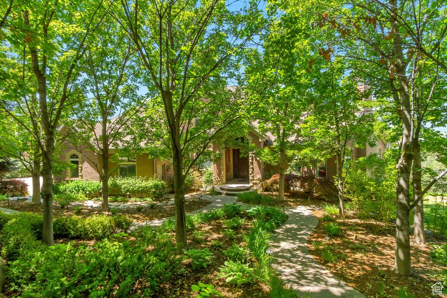 Nestled in the prestigious Holly View Acres, this 7.58-acre estate offers an extraordinary combination of luxury, privacy, and investment potential. Situated on a quiet cul-de-sac, the property is fully gated and fenced, ensuring peace of mind while embracing breathtaking 360-degree mountain views. With four total parcels, this estate presents a rare opportunity to develop, expand, or create a private retreat that backs directly up to US Forest Service Land, preserving privacy and views. The formal living room makes a dramatic first impression, featuring a vaulted ceiling, exposed wood beams, and a luxurious fireplace that serves as the focal point of the space. Expansive windows allow for abundant natural light, highlighting the warmth and elegance of the room. Just beyond, the kitchen is designed for both functionality and entertaining, featuring double wall ovens, a built-in countertop gas range, and a semi-formal dining space. A formal dining room sits adjacent, offering the perfect setting for hosting and entertaining. At the heart of the home, the Great Room boasts a soaring vaulted ceiling, and seamlessly connects to the balcony deck, creating an effortless indoor-outdoor living experience. Enjoy single level living with the Primary Suite on the Main Level, providing a luxurious retreat complete with an oversized shower, jetted soaker tub, and a connecting den with built-in hardwood shelving and workspace for work or relaxation. With 7 bedrooms and 6.5 bathrooms, this home offers abundant space for family and guests alike. Laundry rooms on every level add convenience to daily living, ensuring ease and efficiency throughout the home. The walkout basement is designed for versatility, featuring a full kitchen, designated dining area, and family room with its own separate entrance, making it an ideal mother-in-law apartment, guest suite, or private retreat. The basement is also host to a theater room with stadium seating, making family nights & entertainment at home a breeze. A dedicated wellness and recreation prep area within the basement includes a separate bathroom, shower, Finlandia Sauna, and a Suitmate Swimsuit Water Extractor, ensuring a spa-like retreat after a swim or workout. The indoor heated pool and spa is housed separately from the main residence yet remains easily accessible through the basement entrance. Designed for year-round enjoyment, this space features sliding glass doors around the structure, allowing for an open-air experience when the weather is nice. The surrounding area provides ample room for games, activities, and hosting, making it an entertainer's dream. Stepping outside, the backyard is a paradise for recreation and relaxation, featuring play gyms and equipment for kids, a putting green, a tennis court, and a large greenhouse for homesteading. Whether enjoying outdoor activities or simply taking in the breathtaking scenery, this estate offers an unmatched setting for enjoying the great outdoors. With a stunning paver driveway and oversized 3-car garage with plenty of room for vehicles, toys, and storage, this Estate truly is the perfect blend of practicality and luxury. With its prime location, expansive acreage, and endless amenities, this estate is a rare find in Alpine. Don't miss the opportunity to experience this one-of-a-kind property-schedule a private tour today! Buyer/Buyer's Agent to verify all.