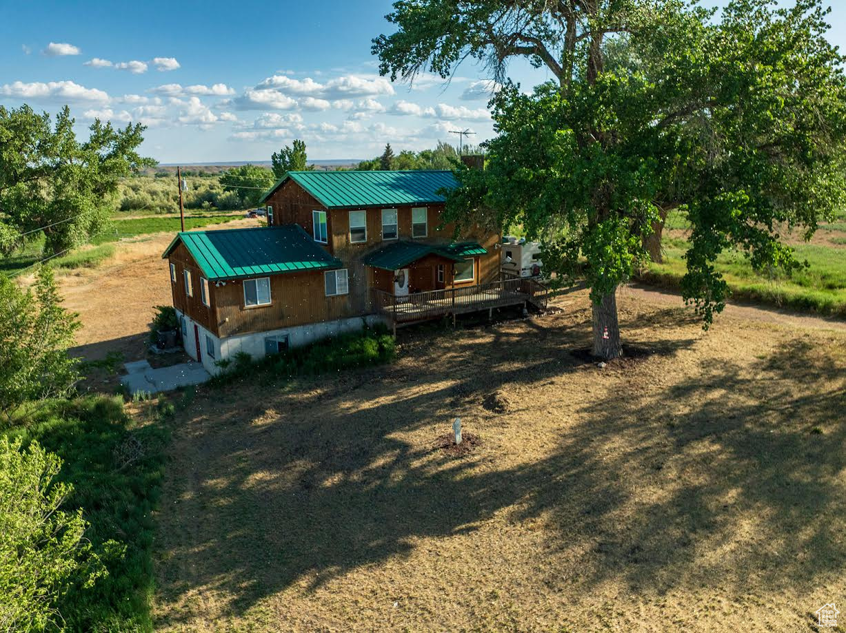 ARCADIA!!! HORSE PROPERTY!! High demand, low supply area! A free flowing, shared well! PLUS 2 shares irrigation water! East Duchesne Culinary Water hook ups are available if buyer wishes to pay to hook on. Very near the Duchesne River! Enjoy serene country views, spectacular sunrises, sunsets, and wildlife from 2 oversized, covered decks, front and back!! Main floor open concept living, dining, kitchen and breakfast room with beautiful rustic hickory built-ins and cabinets! Gas log fireplace. 3 bedrooms, 1 bath on the main floor. Living room has gas log fireplace, ceiling fan, and window seat. Top floor Master Suite consists of huge bedroom with his and her closets, open to master bath with his and her sinks, shower and separate jetted garden tub! Also includes a study (which could be another bedroom), and a huge craft room that could easily be used as a second living area! Kitchen includes microwave and 5 burner gas cook top, double electric wall ovens, and a huge walk-in pantry! 1500 square foot partially finished basement with separate entrance is plumbed for possible separate apartment for family or for income. Check out this beautiful place!! Beautiful home, beautiful setting in a beautiful area!! It is just so peaceful and quiet! Property to be sold in "as is" condition. 35.58 additional acreage available with another 19.4 shares water. This piece is riverfront on the Duchesne River and is home to pheasant, wild turkey, geese, ducks, and many other species of water foul. Resident deer, elk, and occasional moose! Ask us about price!