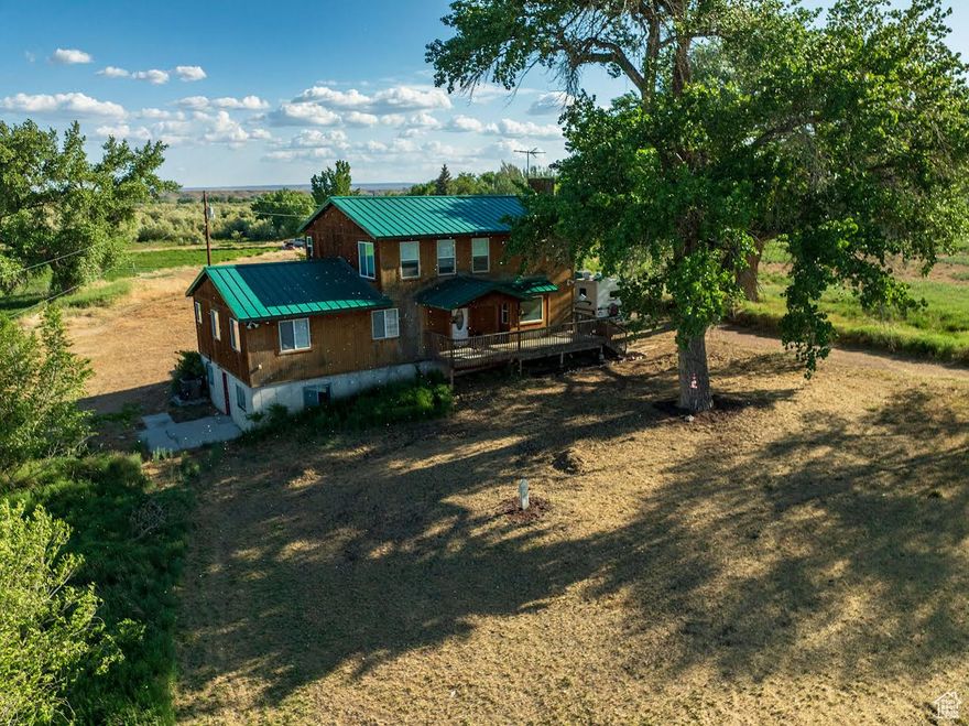 ARCADIA!!! HORSE PROPERTY!!  High demand, low supply area!  A free flowing well!  PLUS 5 shares irrigation water!  East Duchesne Culinary Water hook ups are  available if buyer wishes to pay to hook on.  Very near the Duchesne River!  Enjoy serene country views, spectacular sunrises, sunsets, and wildlife from 2 oversized, covered decks, front and back!! Main floor open concept living, dining, kitchen and breakfast room with beautiful rustic hickory built-ins and cabinets! Gas log fireplace. 3 bedrooms, 1 bath on the main floor. Living room has gas log fireplace, ceiling fan, and window seat. Top floor Master Suite consists of huge bedroom with his and her closets, open to  master bath with his and her sinks, shower and separate jetted garden tub!  Also includes a study (which could be another bedroom), and a huge craft room that could easily be used as a second living area! Kitchen includes microwave and 5 burner gas cook top,  double electric wall ovens, and a huge walk-in pantry! 1500 square foot partially finished basement with separate entrance is plumbed for possible separate apartment for family or for income.  Check out this beautiful place!! Beautiful home, beautiful setting in a beautiful area!!  It is just so peaceful and quiet!  Property to be sold in "as is" condition.  35.58 additional acreage available with another 19.4 shares water, and water rights for 50 head of stock.  This piece is riverfront on the Duchesne River and is home to pheasant, wild turkey, geese, ducks,  and many other species of water foul.  Resident deer, elk, and occasional moose! Ask us about price!