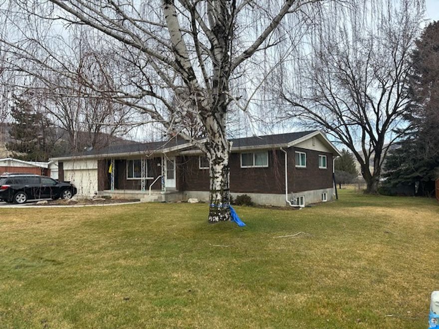 Move away from the hustle and bustle to quiet and peaceful Mantua. This spacious 5-bedroom, 3-bath brick home is on a .48 acre lot which offers a view of the lake and is within a very short walking distance to the trail around the lake.  Roof was  installed about 3 years ago. You'll love the open floor plan on the main floor for entertaining with many recent upgrades including newer laminate floors for easy upkeep. The custom rock fireplace is gas on the kitchen side and electric on the living room side. The main bath has a walk-in tub and there is also a large main-floor laundry  just off garage. Downstairs features a family room with a gas fireplace plus an extra kitchen and 3/4 bath that were recently finished. There are auto sprinklers and full landscaping except for in back of the shed. Relax on the covered patio or newer deck and enjoy the large backyard and view of the lake. Great opportunity to live in Beautiful Mantua.