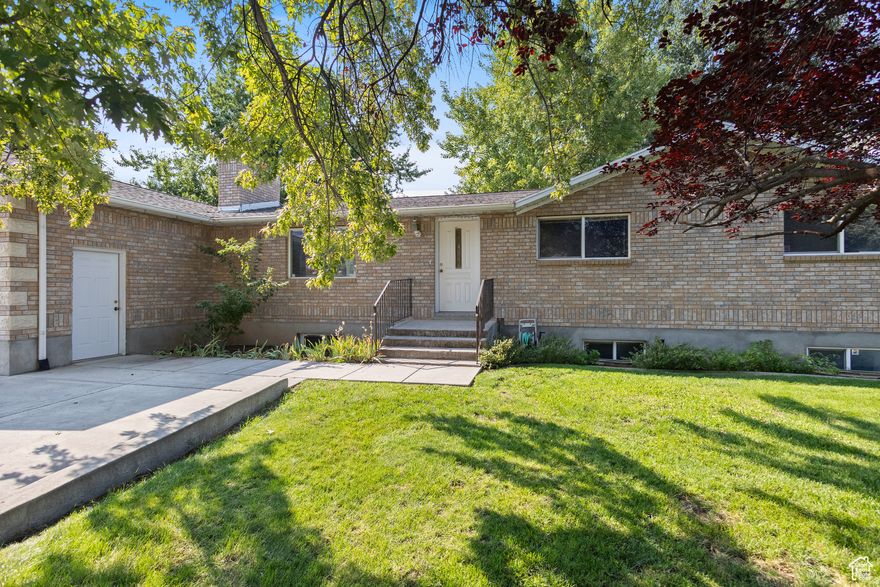 Welcome to this charming South Lindon home on a spacious .46-acre lot! Originally built in 1977 and thoughtfully remodeled in 1992, this property offers expanded living space and a fully finished basement. Inside, you'll find brand-new carpet and beautiful bamboo flooring in the kitchen and dining areas. The home is designed with convenience in mind, featuring two laundry hookups and generous storage throughout. For those who love extra space to work or play, the property includes a deep detached workshop/garage, perfect for projects, hobbies, or additional storage, along with a two-car attached garage. With its blend of character, updates, and room to grow, this home is a fantastic opportunity in a highly desirable location