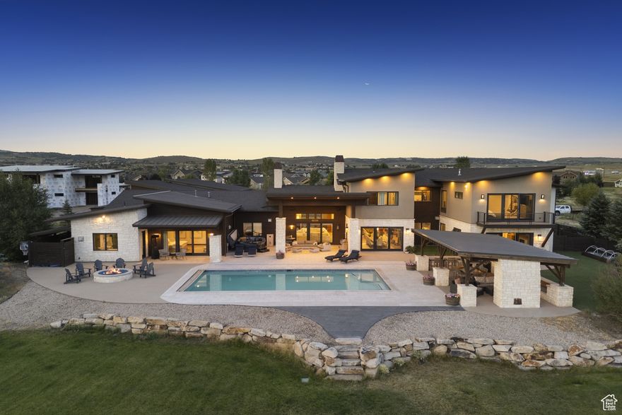 Set on 10 private acres in the coveted Silvercreek neighborhood, this expansive Park City estate offers commanding, unobstructed mountain views and an impressive 12,100 square feet of refined living space. Built in 2015, the home is thoughtfully designed for both elevated everyday living and large-scale entertaining, with a layout and setting that offer space, privacy, and connection-just minutes from everything Park City has to offer.  The home features 7 large bedrooms and 9 bathrooms, providing ample room to host, relax, and recharge. Nearly 2 acres are fully fenced and landscaped, with a pool, hot tub, gazebo, and firepit-all positioned to capture the stunning mountain views. Inside, limestone and hardwood floors, 7 fireplaces, and light interior stone walls add warmth and natural elegance throughout the main living areas.  Additional highlights include a 1,500-square-foot gym with a partial basketball court, a game room, central heating and air, and a dedicated wine room. Garage space accommodates up to 8 vehicles, including two oversized, double-deep bays. The property is being offered fully furnished, making it move-in ready from day one.  Ideally located just 10 minutes from Kimball Junction and Whole Foods, 15 minutes from the East Village at Deer Valley, and with quick access to both Heber City and Salt Lake City International Airport, this is a rare opportunity to own a home that balances beauty, comfort, and convenience-set against one of Park City's most dramatic and expansive view corridors.