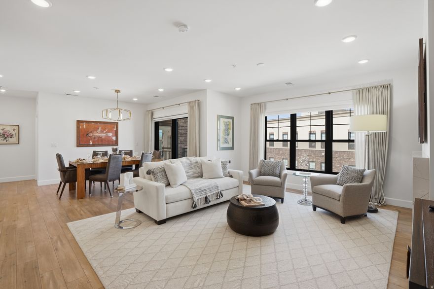 Welcome to this three bedroom top floor luxury home at the Station Condominiums in the heart of downtown Holladay. This open floor plan has beautiful natural light in every room, secure underground climate-controlled parking, elevator and ample storage. This maintenance free lifestyle, secure building is located right in the heart of the Holladay City Village where a short walk gets you to many amenities including dining, shopping, grocery stores, food trucks, coffee shops, bakeries, post office, and entertainment. Enjoy the spectacular rooftop patio, complete with a fire pit, BBQ, gazebo, and lounge area and marvel in the 360 degree views of the mountains and Salt Lake Valley. Located just 20 minutes from the airport, 30 minutes to Alta ski resort and 40 minutes to Park City.