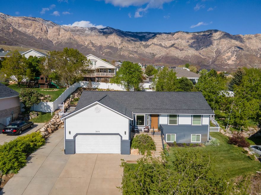 Perched with beautiful mountain and valley views, this spacious home offers comfort, functionality, and room to gather both inside and out. The main level features an open-concept living area that flows seamlessly to a large patio-perfect for entertaining or relaxing in the included hot tub while enjoying the scenery. You'll also find three bedrooms and two bathrooms on the main floor, creating convenient single-level living.      Downstairs, the fully finished basement provides even more flexible living space with three additional bedrooms, one bathroom, and a large family room ideal for movie nights, hosting guests, or game days. One of the basement bedrooms is currently being used as a home gym and features its own walkout entrance to the side yard. The included sauna adds a unique touch for relaxation and wellness at home.      Major updates have already been completed, including a new roof and triple-pane windows installed in 2022, offering both efficiency and long-term value. Seller is also offering $5,000 toward buyer closing costs.      This home combines space, views, and thoughtful updates in a setting that's ready to enjoy. Come see everything it has to offer.  Square footage figures are provided as a courtesy estimate only and were obtained from county records. Buyer is advised to obtain an independent measurement.