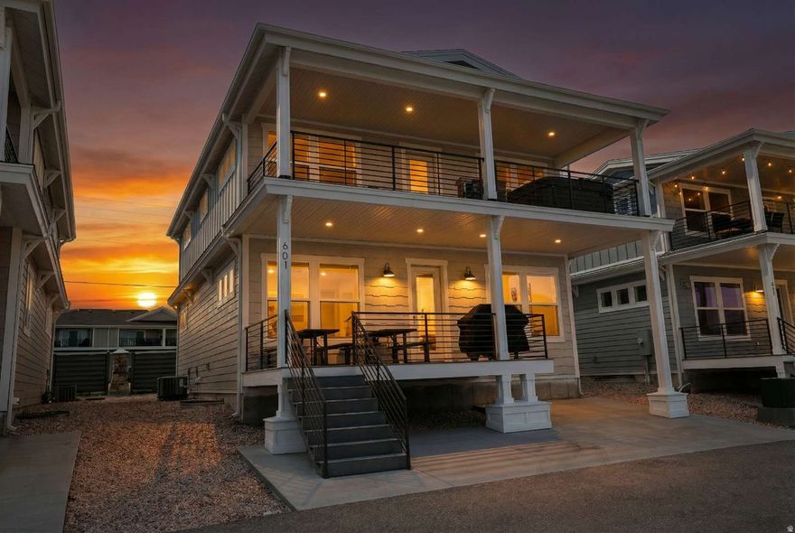 Experience lakefront living at its finest at Legacy Beach Lookout, a stunning home located in the sought-after Legacy Beach Resort in Garden City. Perfectly positioned just a short walk from the shoreline of Bear Lake, this beautifully designed 6-bedroom, 6-bathroom retreat offers exceptional comfort, space, and views. Sleeping up to 22 in beds with a maximum occupancy of 24, the home features three luxurious master suites and high-end mattresses throughout, making it ideal for large gatherings or vacation rentals.  Take in breathtaking lake views from your private patio, complete with your own hot tub-perfect for enjoying peaceful sunrises over Bear Lake. Inside, the thoughtfully designed floor plan caters to both relaxation and entertaining. The main level features a spacious open-concept living room and kitchen, ideal for hosting, along with a bedroom and 1.5 bathrooms, including a main-level master suite with a king bed and private bath.  Upstairs, you'll find three additional bedrooms, including a king suite with a private bathroom and lake views, along with two well-appointed rooms each featuring a queen bed and twin bunk. A deck on this level offers a perfect place to unwind and take in the scenery. The lower level is designed for fun and entertainment, with a large family room, arcade games, and two more bedrooms-one set up with two bunk beds and a queen, and the other with a queen bed and twin bunk, making it a perfect space for kids or extra guests.  Legacy Beach Resort amenities include a clubhouse, fitness center, swimming pool, and hot tub, all just a short walk away. Whether you're looking for a private getaway or a high-performing rental property, this lakefront home offers the best of Bear Lake living.