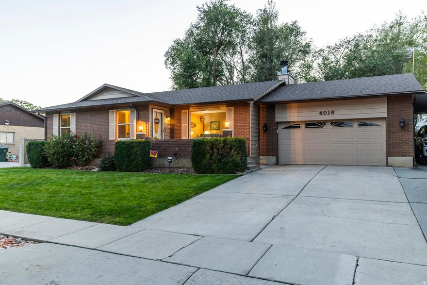 Looking for a beautifully maintained rambler with tons of space and a super convenient location? This West Valley gem is nestled in a lovely neighborhood lined with mature trees and sits on a spacious .18-acre lot with easy access to Bangerter Highway, making your commute around the Salt Lake Valley a breeze. Inside, the main level feels bright and welcoming with an updated kitchen featuring stainless steel appliances (including a double-drawer freezer fridge!), recessed lighting, gorgeous tile, and a large island. The kitchen flows into the living space for easy everyday living. You'll also find three nicely sized bedrooms, including the primary with double closets and an ensuite bath, plus a convenient main-level laundry room. The fully finished basement adds even more versatility with a huge family room and wet bar, an additional bedroom and bathroom, a cold storage room, and a flexible bonus space perfect for a movie room, game room, home gym, or playroom. Outside, the fully fenced backyard is flat and beautifully maintained with a large covered patio, garden area, and plenty of space to entertain. A 2-car garage, covered side parking, and RV parking offer ample room for vehicles and storage. All of this comes in an incredibly central location-minutes from Valley Fair Mall, parks, restaurants, hospitals, and grocery stores, with Downtown Salt Lake City just 20 minutes away and Silicon Slopes around 30 minutes. Come see this wonderful home today!