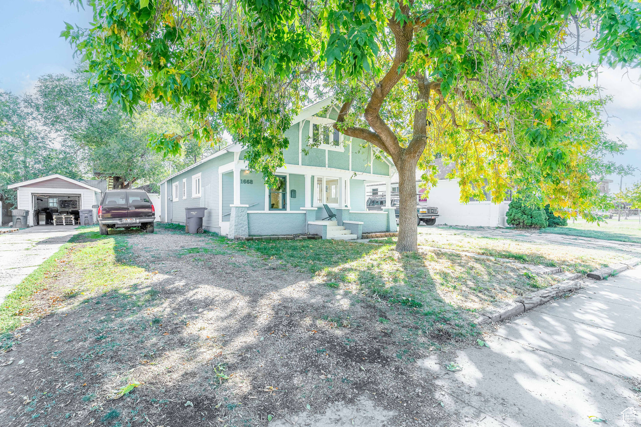 Charming Bungalow with new flooring, paint, updated bathrooms and light fixtures, covered porch and patio, newer roof, furnace and swamp cooler. 1 gravel driveway to the detached garage and 1 gravel driveway for extra parking. Buyer and buyers agent to verify all.