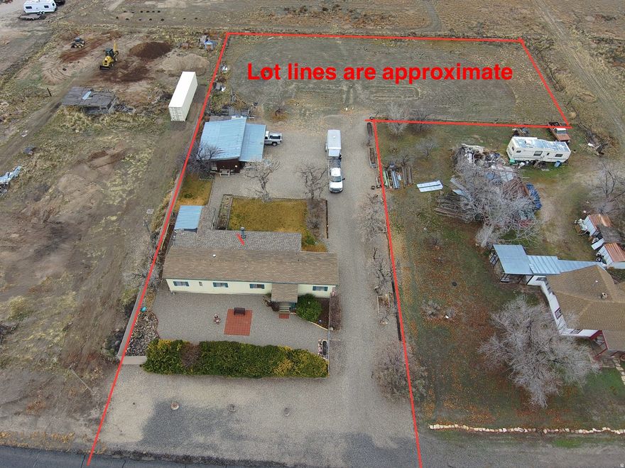 Horse Property on .97 Acres with Animal Rights, Workshop, Greenhouse & Subdivision Potential! Rare small-acreage opportunity ideal for horses, hobby farming, homesteading, gardening, and RV parking. This fully fenced property offers mature landscaping, (2) water rights, and potential to subdivide and build on the back portion, combining country living with future investment potential.