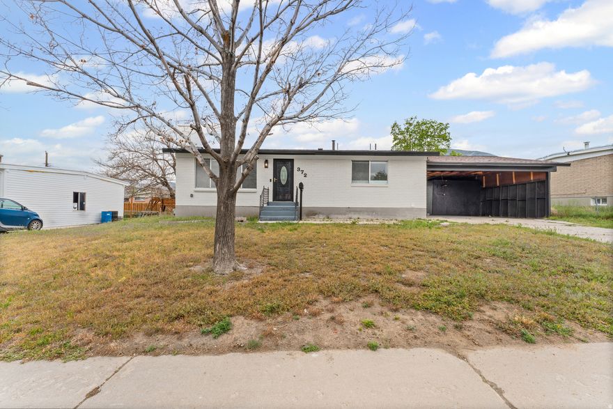 Experience the pinnacle of modern living in this meticulously renovated Tooele rambler, where every detail has been reimagined for the sophisticated buyer. From the moment you arrive, the striking modern brick exterior and ideal curb appeal set a high bar that the interior effortlessly meets. Step inside to discover a seamless open-concept family room bathed in natural light, featuring brand-new flooring, designer paint, and custom baseboards throughout. The chef-inspired kitchen is a true centerpiece, boasting sleek new cabinetry, elegant quartz countertops, and a semi-formal dining space designed for effortless entertaining. The main level further impresses with three spacious bedrooms offering serene mountain views and a showstopping bathroom featuring floor-to-ceiling custom tile and a contemporary vanity. The transformation continues in the expansive lower level, which offers incredible versatility and potential. With a convenient semi-walkout entrance, this space is perfectly suited for a potential mother-in-law apartment or a premium guest suite, complete with a massive family room, two additional bedrooms, and a luxurious 3/4 bathroom with matching floor-to-ceiling tile. Practicality meets style with a large, dedicated laundry room and abundant storage space. Outside, the fully fenced backyard provides a private oasis for summer barbecues and outdoor recreation. With all-new lighting, hardware, and mostly new appliances, this home offers the turn-key peace of mind of a new build with the character of an established neighborhood. Truly a rare find, schedule your private tour today. Buyer and Buyers agent to verify all information. Square footage figures are provided as a courtesy estimate only. Buyer is advised to obtain an independent measurement.