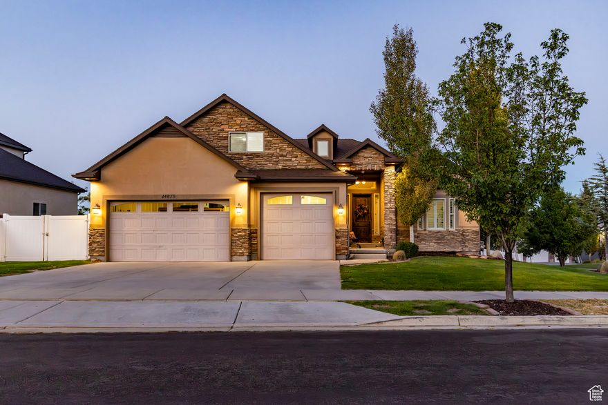 Welcome to Rosecrest living at its finest! Perfectly positioned on a corner lot, this home offers stunning Wasatch Mountain views and blends quality craftsmanship with thoughtful design. Enjoy main floor living with vaulted ceilings, an open floor plan ideal for entertaining, an impressive stone fireplace, and rich natural wood floors throughout. The chef's kitchen features a large island, granite countertops, and stainless steel appliances, including a gas range perfect for your culinary creations. A spacious bonus room upstairs adds even more flexibility.  Outdoor living is a dream with a covered deck, complete with gas hookups for your BBQ, accessible from both the great room and the private primary suite, perfect for soaking in sunrise and sunset views. The fully finished walk-out basement offers additional gathering space, ample storage, and a covered patio enhanced with a TV mount, firepit, and 220v ready for a future hot tub, all overlooking the beautifully terraced and landscaped yard. A large shed provides extra storage for toys and outdoor gear.  Vast windows with custom plantation shutters fill the home with natural light. The spacious 3-car garage includes 220v power and built-in shelving. Close to Blackridge Reservoir, Mountain View Village shopping, dining, and entertainment, plus scenic trails just steps away. Originally built by Sage, this is a home you'll love coming back to every day!