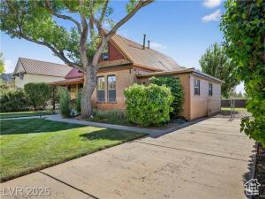 This charming, remodeled 2-bed, 2-bath home in historic Parowan offers turn-of-the-century character with modern comfort & can be used as a nightly rental. Enjoy updated heating, A/C, luxury vinyl bedroom flooring, & a cozy gas stove in the sun-filled living room. The kitchen boasts panoramic windows & an antique wood-burning stove. The primary suite has a private entrance, large vanity, & access to a spacious laundry room. French doors open to a west-facing deck & a fenced yard with mature trees, RV parking, & a new garden shed. Bonus upstairs room perfect for office or crafts. Across from the park and close to Main Street, dining, Brian Head skiing, & The Gap petroglyphs.