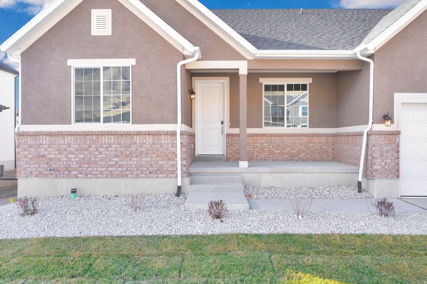 Current Incentives have rates as low as 3.75% FHA/VA. Restrictions apply contact for details!!    Nestled near the majestic mountains, this exceptional community is a haven for outdoor enthusiasts, offering hiking, biking, and horse trails just moments from your door. Enjoy the best of both world; peaceful mountain living paired with the convenience of being just a short drive from Salt Lake City International Airport and vibrant downtown Salt Lake for work, entertainment, and travel. From the moment you step onto the covered front patio, you'll feel a sense of retreat from the hustle and bustle of everyday life. Inside, the gourmet kitchen is a chef's dream, designed for both function and beauty. The sunroom, seamlessly connected to a covered patio, creates the perfect space for hosting friends and family or enjoying quiet mornings. Step into your primary retreat; a luxurious sanctuary featuring an extended sitting area, dual closets, a garden tub, and a separate shower designed for ultimate comfort. Working from home? Enjoy a dedicated office space with elegant French doors, offering the privacy and quiet you need to stay productive.