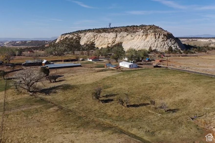 Another Huge price reduction!! Way below market value & appraisal!   Rare to find over 6  acres in Boulder with incredible 360 degree views!  Recently remodeled and move-in ready.  Perfect retreat for nature lovers. Just minutes from Grand Staircase-Escalante National Monument, enjoy world-class hiking, off-roading, and endless outdoor adventure right at your doorstep. This property includes  A & C irrigation shares (approx $200k in value) - ideal for gardening, livestock, and more. With room to roam and relax, this property offers the best of rural living and epic exploration! Charming  3-bedroom, 2-bath manufactured home offers 1,585 sq ft of stylish comfort on a sprawling 6.49-acre lot. Spacious kitchen with island, new pellet stove, new furnace, newer appliances, barn-door, metal roof, updated cabinets, flooring & much more!  Situated in town with incredible views of Sugarloaf, and Boulder Mountain, this parcel is perfect for your recreational getaway or full-time residence. Bring your horses, RV, hiking shoes, and camera to start enjoying peaceful living with dark skies and fresh air. Call for details and to make an appointment to preview this incredible property today.