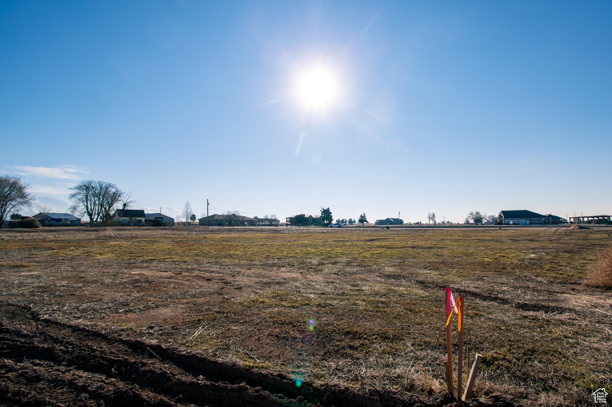 Beautiful, flat, one acre building lot on quiet road in West Weber.  Expansive view of the Wasatch Mountains.   Water, gas  and electric stubbed to the road.  Lot would require a septic tank.  Perk and soil tests have been completed. Come build your dream home.